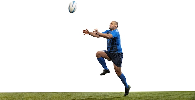 Portrait of male rugby player in motion on grass field isolé sur fond blanc