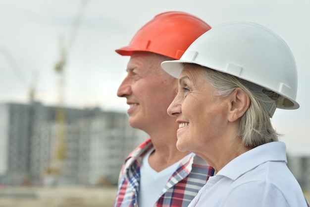 Portrait of senior couple en construction