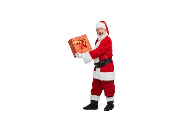 Portrait of senior man in image of santa claus with present fort isolated over white background