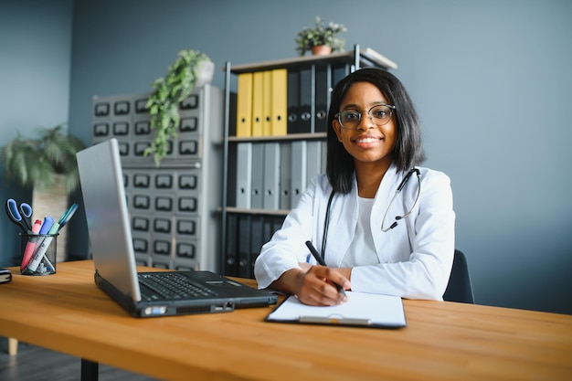 Portrait of Smiling Female Doctor Wearing White Coat With Stethoscope In Hospital Office