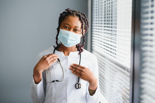 Portrait of Smiling Female Doctor Wearing White Coat With Stethoscope In Hospital Office