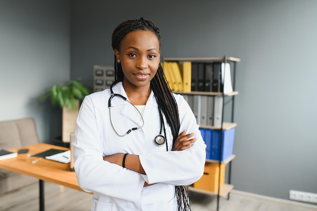 Portrait of Smiling Female Doctor Wearing White Coat With Stethoscope In Hospital Office