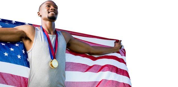 Portrait de sportif heureux posant avec un drapeau américain