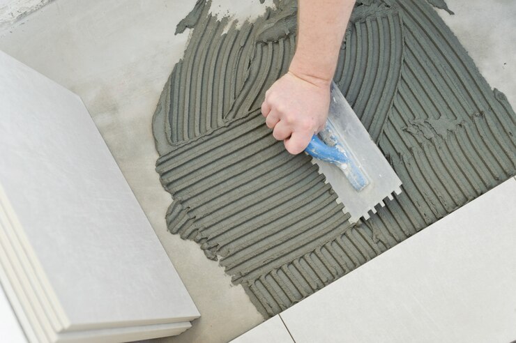 Pose de carreaux de céramique.