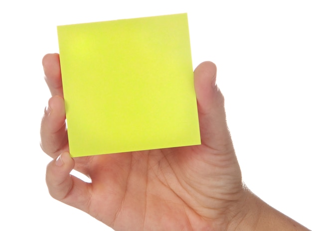 Post-It et main sur un fond blanc