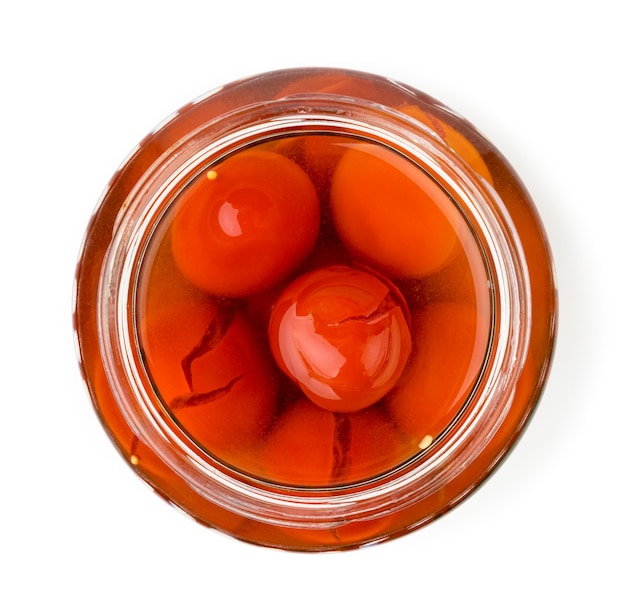 Pot en verre de tomates marinées isolés