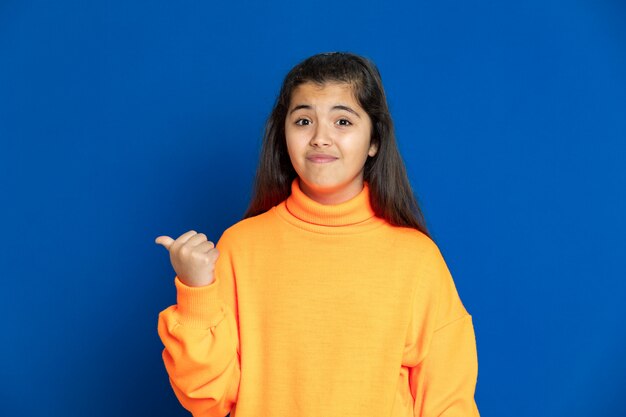 Preteen girl with yellow sweatshirt