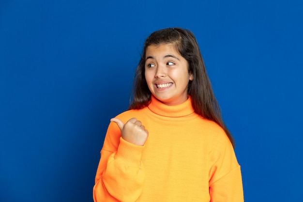 Preteen girl with yellow sweatshirt