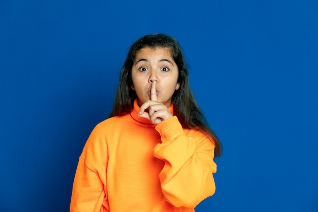 Preteen girl with yellow sweatshirt