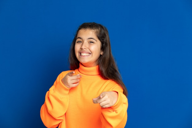 Preteen girl with yellow sweatshirt