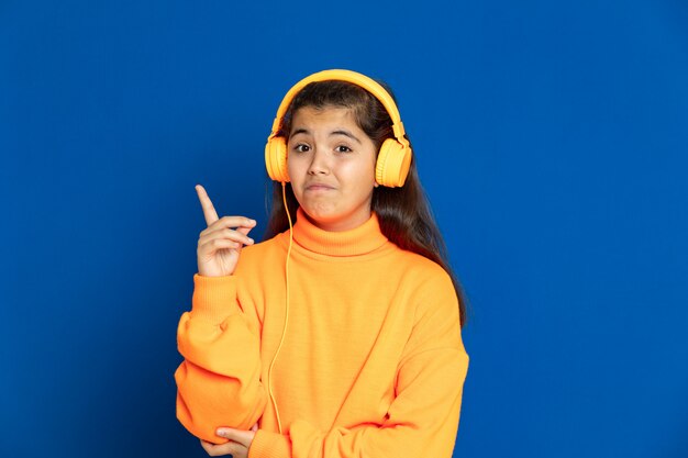 Preteen girl with yellow sweatshirt