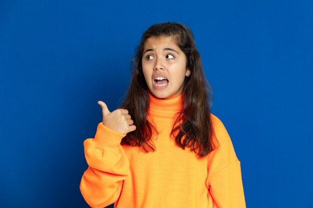 Preteen girl with yellow sweatshirt