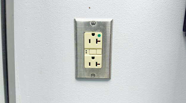 Photo la prise électrique symbolise la connectivité électrique et l'accès à l'électricité. elle représente la