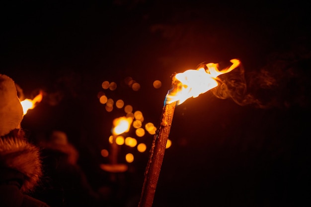 Procession aux flambeaux en attente de Noël