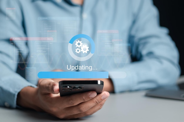 Photo processus de travail et d'installation de mises à jour des logiciels ou des mises à jour du système d'exploitation pour maintenir votre appareil à jour avec des fonctionnalités améliorées dans de nouvelles versions et une sécurité améliorée
