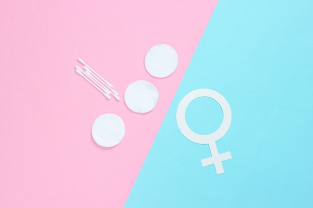 Produits pour l'hygiène féminine, les soins personnels et la santé, symbole de genre féminin sur fond pastel