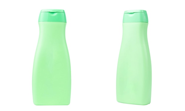 Photo produits de soins du corps en bouteille de couleur verte isolés sur fond blanc. concept de beauté et cosmétique