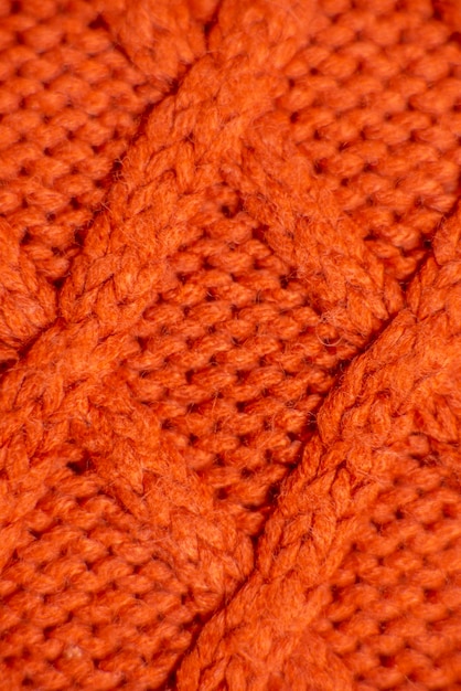 Pull orange tricoté close up background