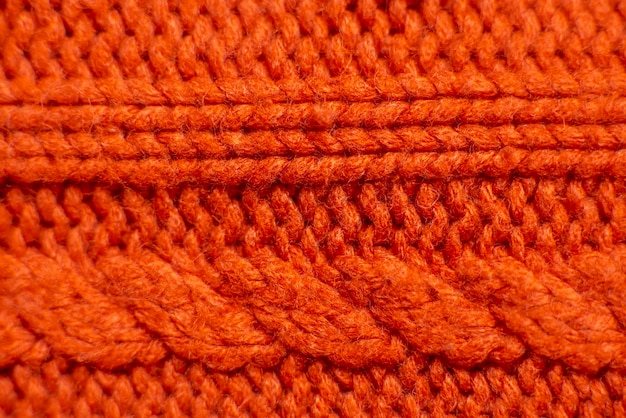 Pull orange tricoté close up background