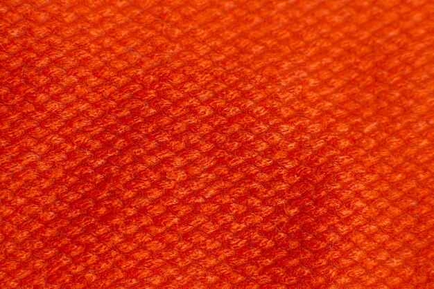 Pull orange tricoté close up background