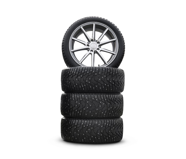 Quatre nouveaux beaux pneus neige isolés sur fond blanc. Un ensemble de pneus de voiture d'hiver cloutés. Un ensemble de roues et de pneus. Pièces de roue. service de pneus
