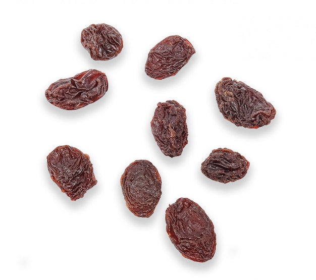 Raisins secs isolés sur blanc avec un tracé de détourage