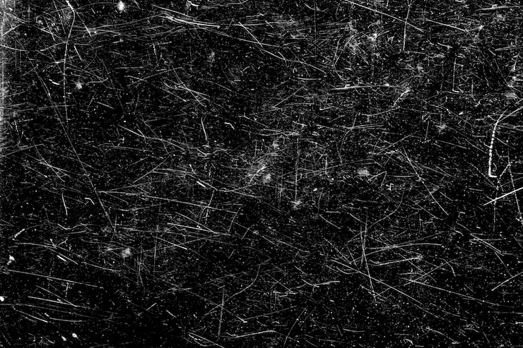 Photo rayures blanches sur fond noir. verre rayé chaotique.