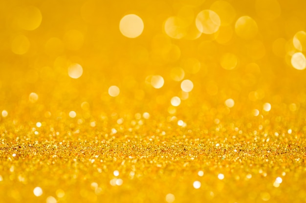 Résumé bokeh de paillettes d&#39;or pour le fond