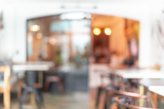 Résumé Le flou du café décoré dans des couleurs chaudes lui donne un aspect chaleureux. Le mobilier du magasin utilise des chaises en fer brun. Le dessus de table utilise le marbre blanc, le fond et le concept de café.