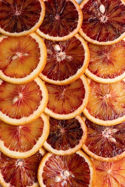 Résumé de fond avec des agrumes de tranches d'orange Motif d'agrumes rouge orange Gros plan