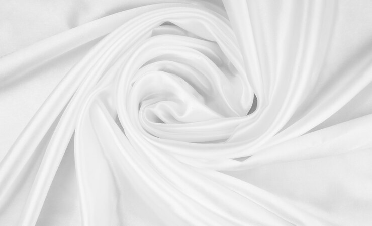 Photo résumé de fond de tissu blanc avec des vagues douces, texture de gros plan du tissu