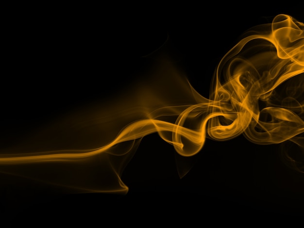 Résumé de fumée jaune sur fond noir, conception de feu