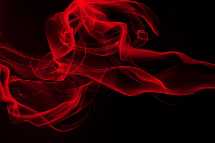 Résumé de fumée rouge sur fond noir, concept de feu et concept de noirceur