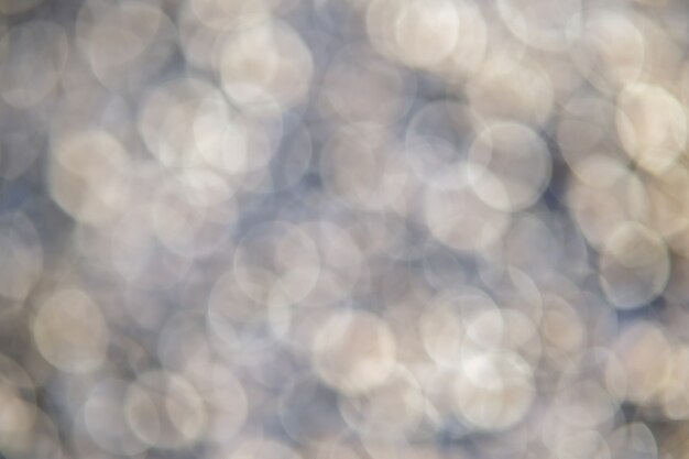 Photo résumé historique des cercles de bokeh crémeux doux.