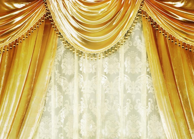 Photo un rideau en or avec un dessin en or