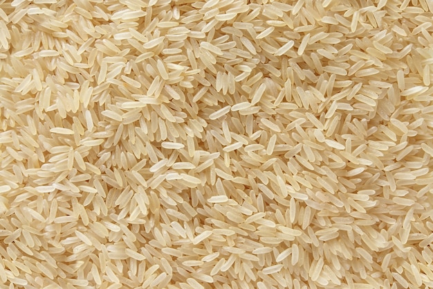 Riz parfumé basmati dispersés vue de dessus fond brut