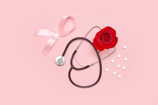 Une rose rouge et un stéthoscope avec un