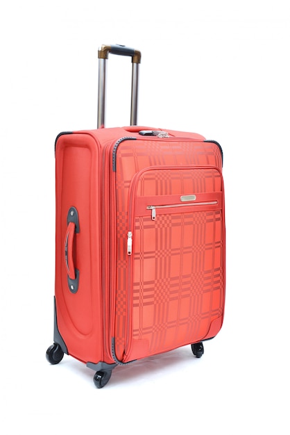 Rouge de grande valise moderne sur un blanc