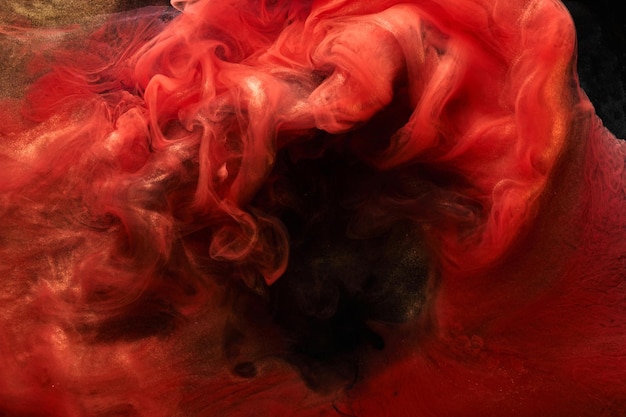 Rouge noir étincelant fond abstrait luxe fumée dorée peinture acrylique explosion sous-marine encre tourbillonnante cosmique