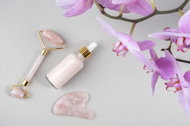 Rouleau facial en cristal de quartz rose, outil de massage Gua sha et collagène anti-âge avec fleurs d'orchidées