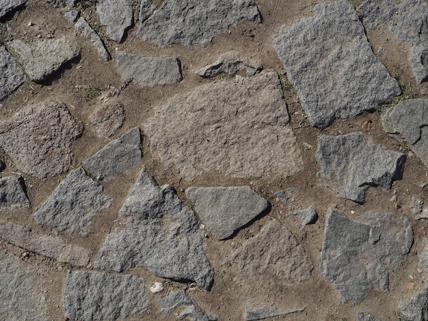 Route pavée Grosses pierres sur la route Arrière-plan de grosses pierres Surface de la route Texture des pierres