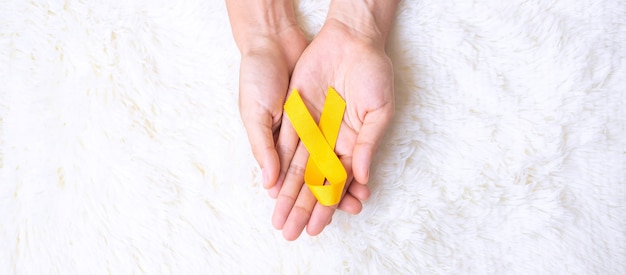 ruban jaune pour la prévention du suicide, le sarcome et la sensibilisation au cancer infantile