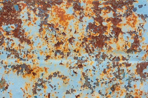 RustOld rusty metal backgroundUn vieux mur de métal bleu avec des taches et des traînées de rouille