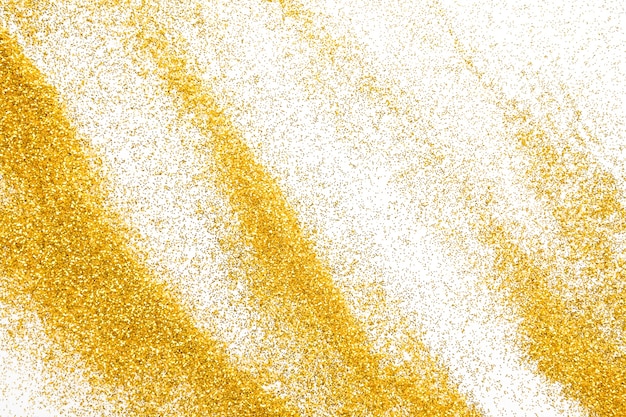 Sable de paillettes d'or isolé sur blanc