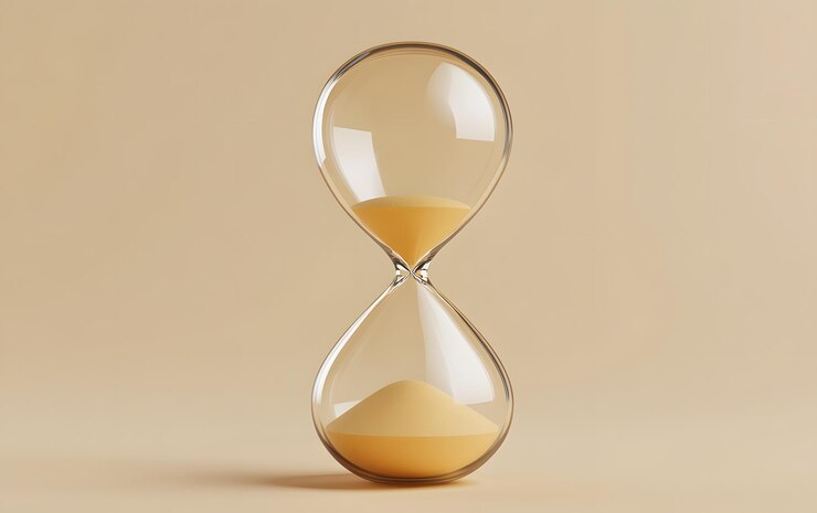 Photo un sablier classique symbolise le passage du temps avec du sable coulant parfait pour les concepts de patience, de gestion du temps et de réflexion.