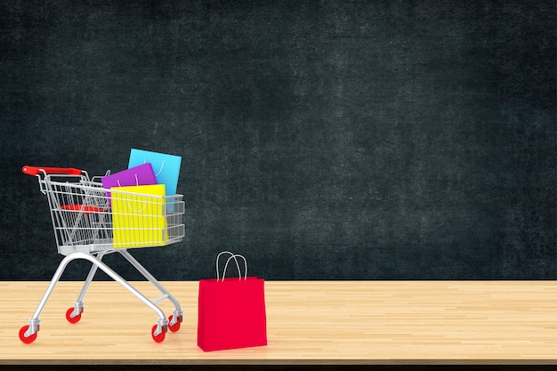 Sacs à provisions en papier coloré dans le chariot sur la table en bois