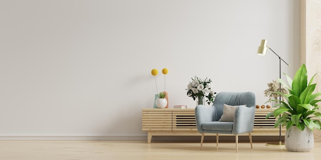 Salon avec armoire en bois et fauteuil sur fond de mur blanc