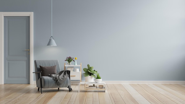 Le salon a un fauteuil sur fond de mur de couleur bleue vide