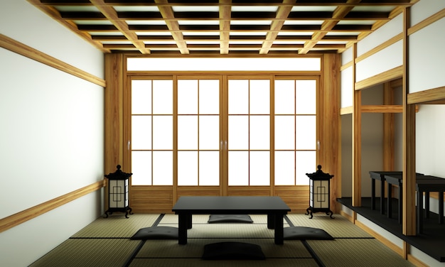 Salon moderne avec table basse noire, lampe, vase et décor de style japonais.