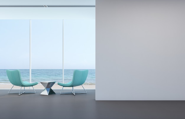 Salon vue mer avec mur blanc dans maison moderne.